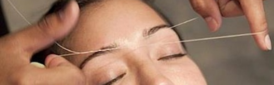 Woman Threading Eyebrows