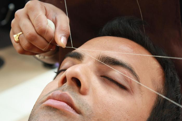Man Having Eyebrows Threaded